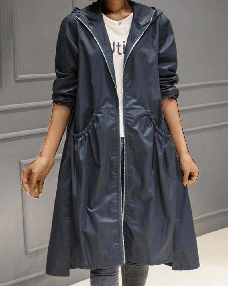 Adrienne | Trench Coat Women Love in a Pleated Longline Fit
